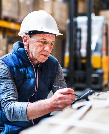 portrait-of-a-senior-male-warehouse-worker-or-a-su-F59H23T.jpg